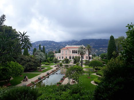 A luxurious mansion surrounded by beautifully designed gardens in Nice, France.