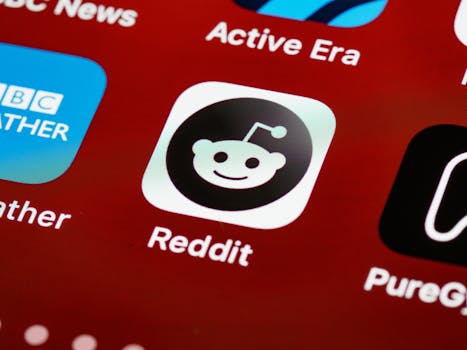 Detailed view of the Reddit app icon on a smartphone screen, used by many foreigners researching retiring in Morocco.