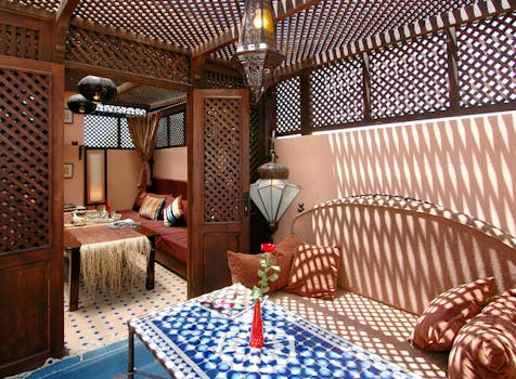 Beautiful traditional Moroccan interior with sunlight patterns and intricate decor.