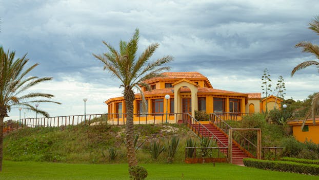 Stunning orange villa with lush greenery in Tabarka, Tunisia.